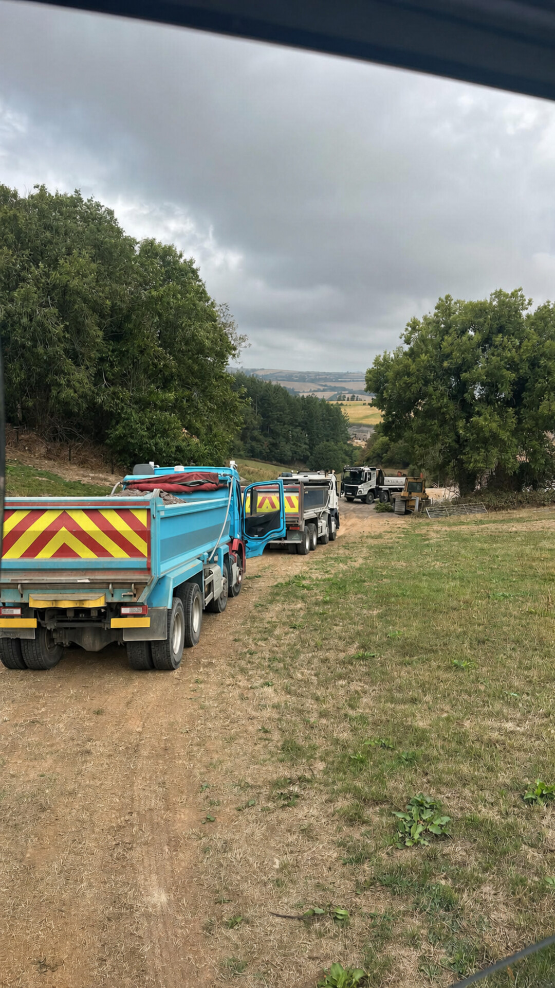 Tipper vehicles supporting work on a rural construction site